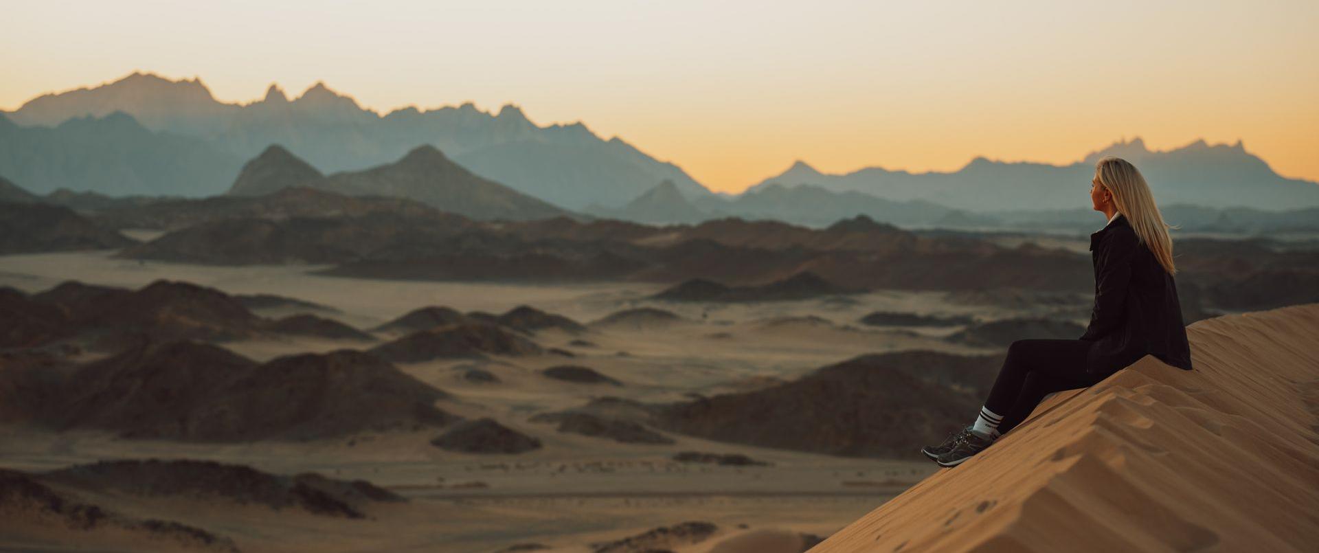 girl watching dunes